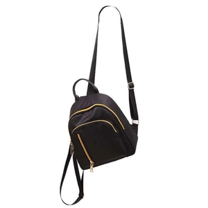 Detail of waterproof black nylon backpack featuring premium golden metal zipper pulls