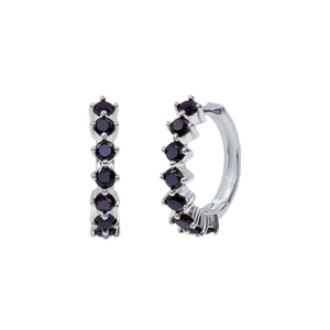 Detail of silver hoop earrings featuring micro-paved dark round zircon gemstones