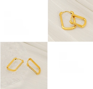 Detail showing polished gold U-shape earrings with inlaid zircon and plating process