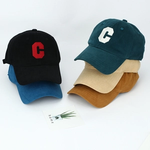 Detailed stack of cotton baseball caps with C embroidery in five assorted colors