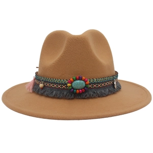 Detail view of ethnic camel fedora hat featuring turquoise gemstone and colorful beads