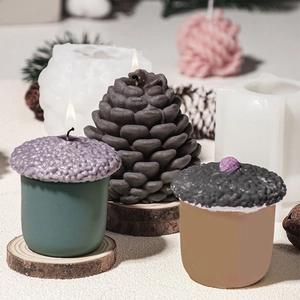 3D pinecone and acorn silicone molds with handmade scented candles in morandi colors