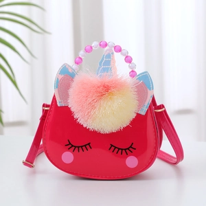 Pink unicorn cross-body bag for girls featuring colorful fur ball and beaded handle