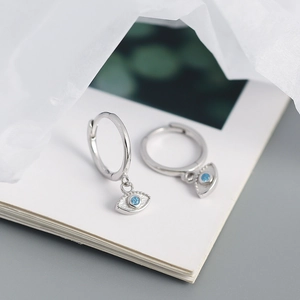Detailed view of S925 sterling silver hoop earrings with blue evil eye charms