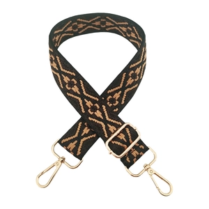 Detail of adjustable 3.8cm jacquard strap with geometric pattern and gold swivel hooks