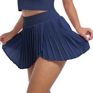 Detailed view of dark blue pleated high-waist tennis skort with premium fabric texture