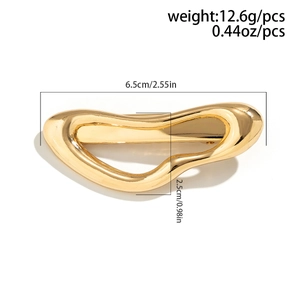 Detail showing irregular gold metal hair claw dimensions of 6.5cm length and 12.6g weight