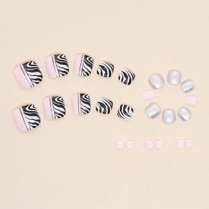 Sparkly zebra pattern and pink press-on toenails set with silver glitter accents