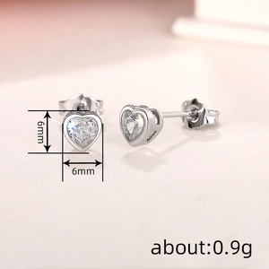 Delicate 6mm heart-shaped cubic zirconia stud earrings in polished 925 silver finish