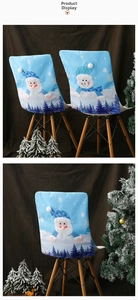 Detail of blue Christmas chair cover with plush Santa and Snowman embroidery