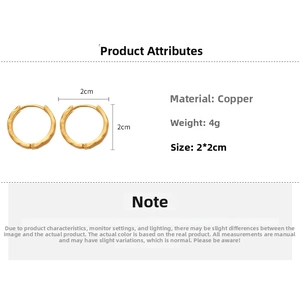 Detail view of gold brushed heart earrings with hammered texture and 2cm size scale
