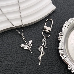Gothic silver zinc alloy jewelry set with skull moth necklace and snake sword keychain