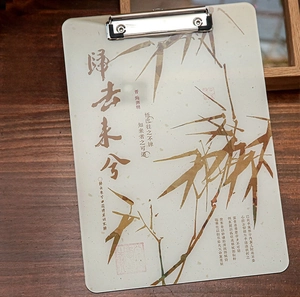 Detail of A4 acrylic clipboard with ink bamboo art and silver metal clip for office use