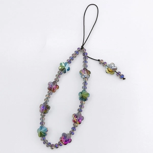 Close-up of handmade iridescent crystal beads and floral charms on a phone lanyard strap