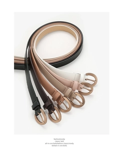 Close-up of stacked colorful PU leather belts with classic metallic pin buckle design