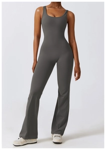 Detail of dark grey jumpsuit featuring flared legs and high elasticity matte fabric
