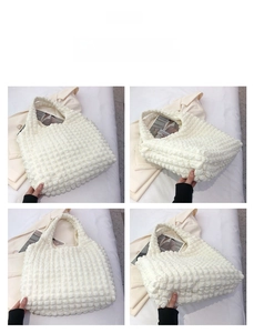 Detail of white popcorn texture fabric on a stylish tote bag with soft pleated design