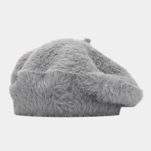 Detail of high-quality grey plush beret hat showing soft faux fur texture and top stalk