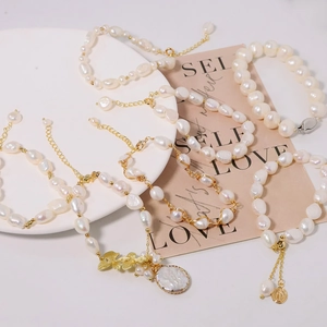 Elegant natural pearl bracelets and necklaces with 18k gold butterfly and coin charms