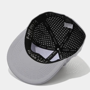 Internal view of grey hip hop baseball cap with laser-cut eyelets and branded inner band