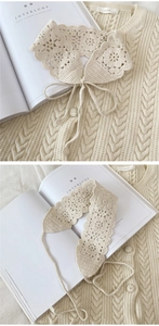 Detail of hollow-out floral crochet collar in cream white with woven strap closure