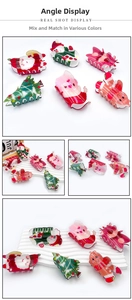 Detailed view of Christmas themed acrylic hair claws with reindeer and tree patterns