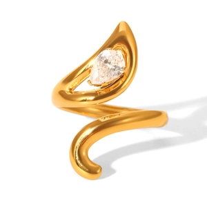 Macro view of gold spiral open ring featuring a pear-cut zircon stone with metallic shine
