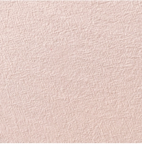 Macro shot of pink linen texture and scalloped edge detail on a modern tablecloth