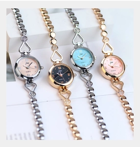 Detail shot of four women's steel jewelry watches with heart accents and crystal decor