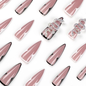 Long stiletto press on nails in dusty rose with silver rhinestone snake accessories