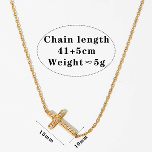 Elegant gold stainless steel cross necklace with pavé crystals and adjustable chain
