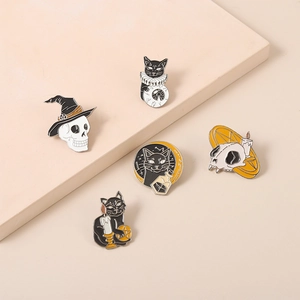Collection of Halloween enamel pins featuring black cat, skull, and magic potion motifs