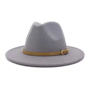 Detail of grey wool felt fedora featuring a brown leather decorative band and gold buckle