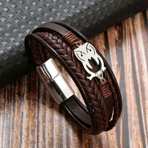Macro shot of brown leather multilayer bracelet with owl metal magnetic clasp