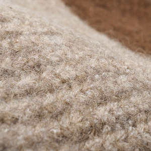 Macro texture detail of high-quality soft knitted wool for a warm winter beanie hat
