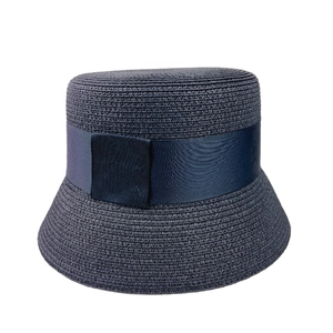 Navy blue straw sun hat with wide satin ribbon trim in a classic bucket hat style