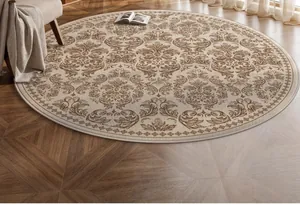 Close-up of a round damask pattern rug on a herringbone floor with warm natural lighting