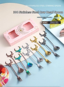Close-up of colorful 304 stainless steel cartoon ox head cutlery sets in gift box