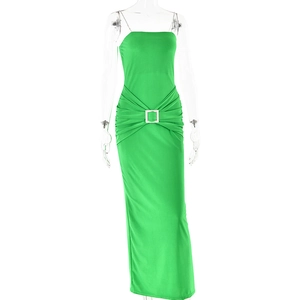 Close-up of elegant green maxi dress with spaghetti straps and silver rhinestone buckle