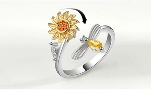 Close-up of rotatable sunflower and bee open ring with vibrant yellow stones detail
