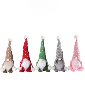 Set of five knitted Christmas gnomes with polka dot hats and white fuzzy pom-poms
