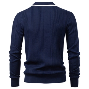 Detail view of the back of a navy blue ribbed knit polo sweater with vertical textures