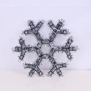 Detailed view of a glittering silver snowflake ornament with a shimmering finish for Christmas