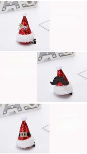 Detail of red sequined Christmas hat hair clips with Merry Christmas logo and belt buckles