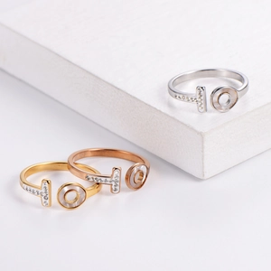 Two-tone gold and silver OT letter ring set with micro-pave crystals and shell inlay