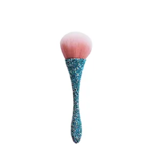 Sparkly waisted loose powder brush with blue rhinestones and soft pink gradient bristles