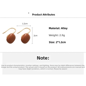 Detail view of tiger eye C-shape square earrings with size and material specifications