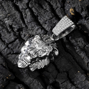 Detailed close-up of a silver lion head pendant with sparkling crystal accents