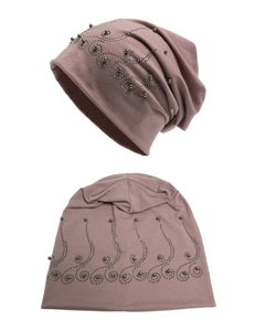 Detail of mauve jersey beanie featuring ornate dark grey beaded swirl patterns