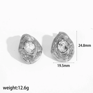 Silver teardrop stud earrings with concentric ripple texture and zircon center stones